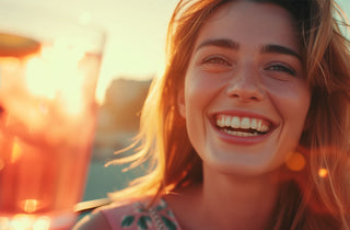 Woman smiling drinking Collagen Drink